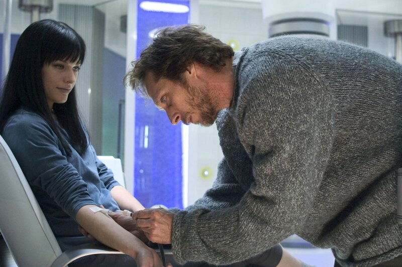 Man drawing blood from woman