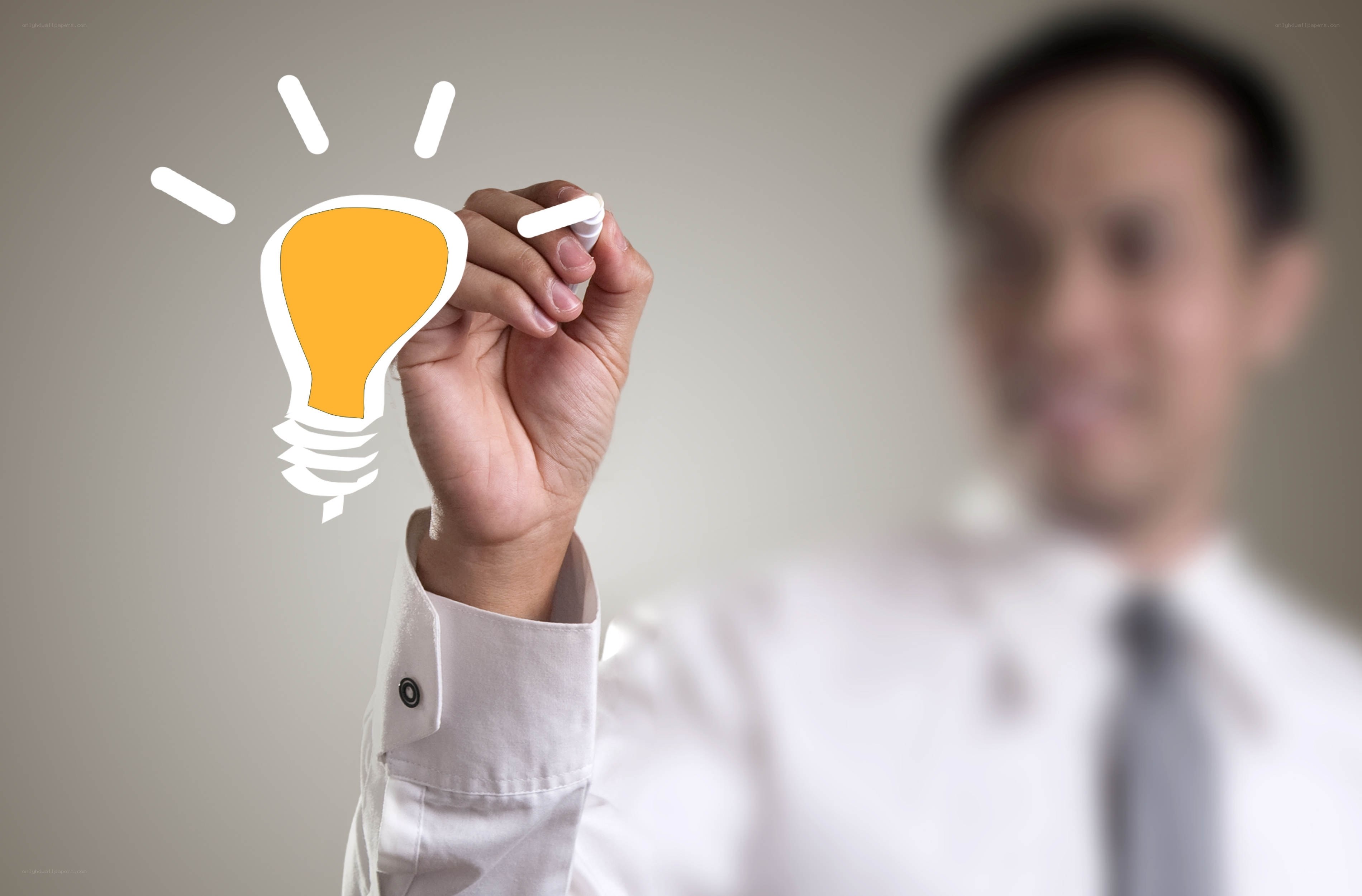man drawing light bulb