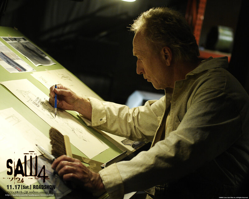 man drawing on a drafting table