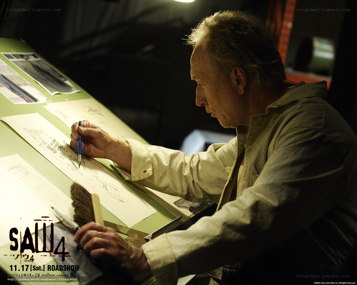 man drawing on a drafting table