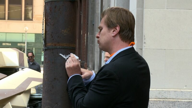 Man drawing on a pole