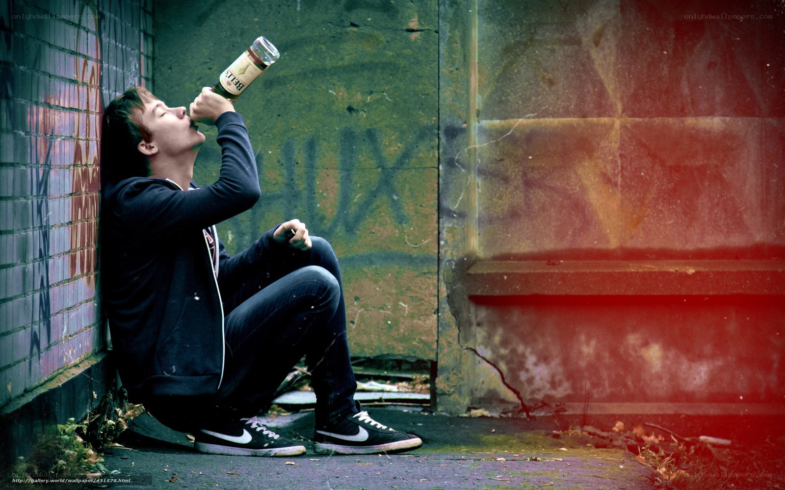 man drinking from bottle