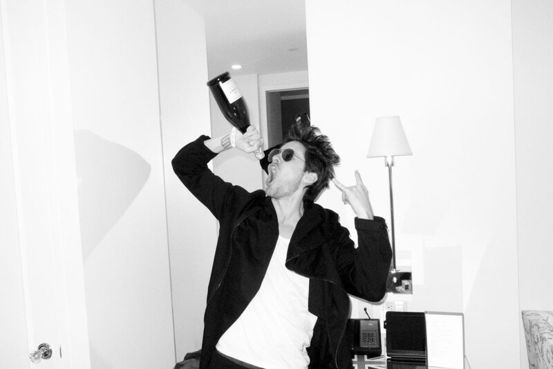 man drinking from bottle