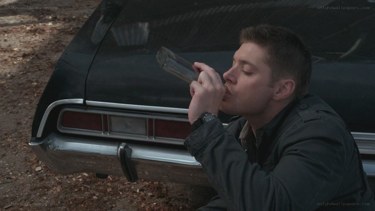 man drinking from bottle