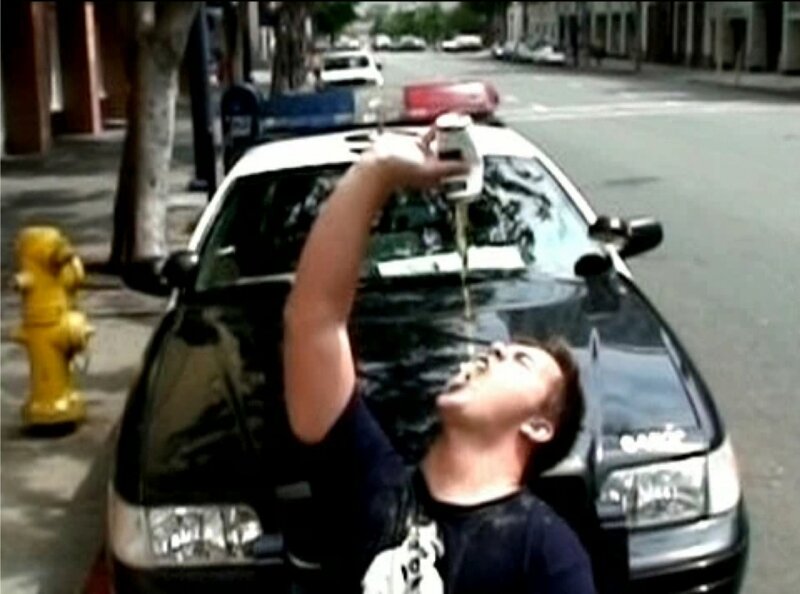 Man Drinking from Can