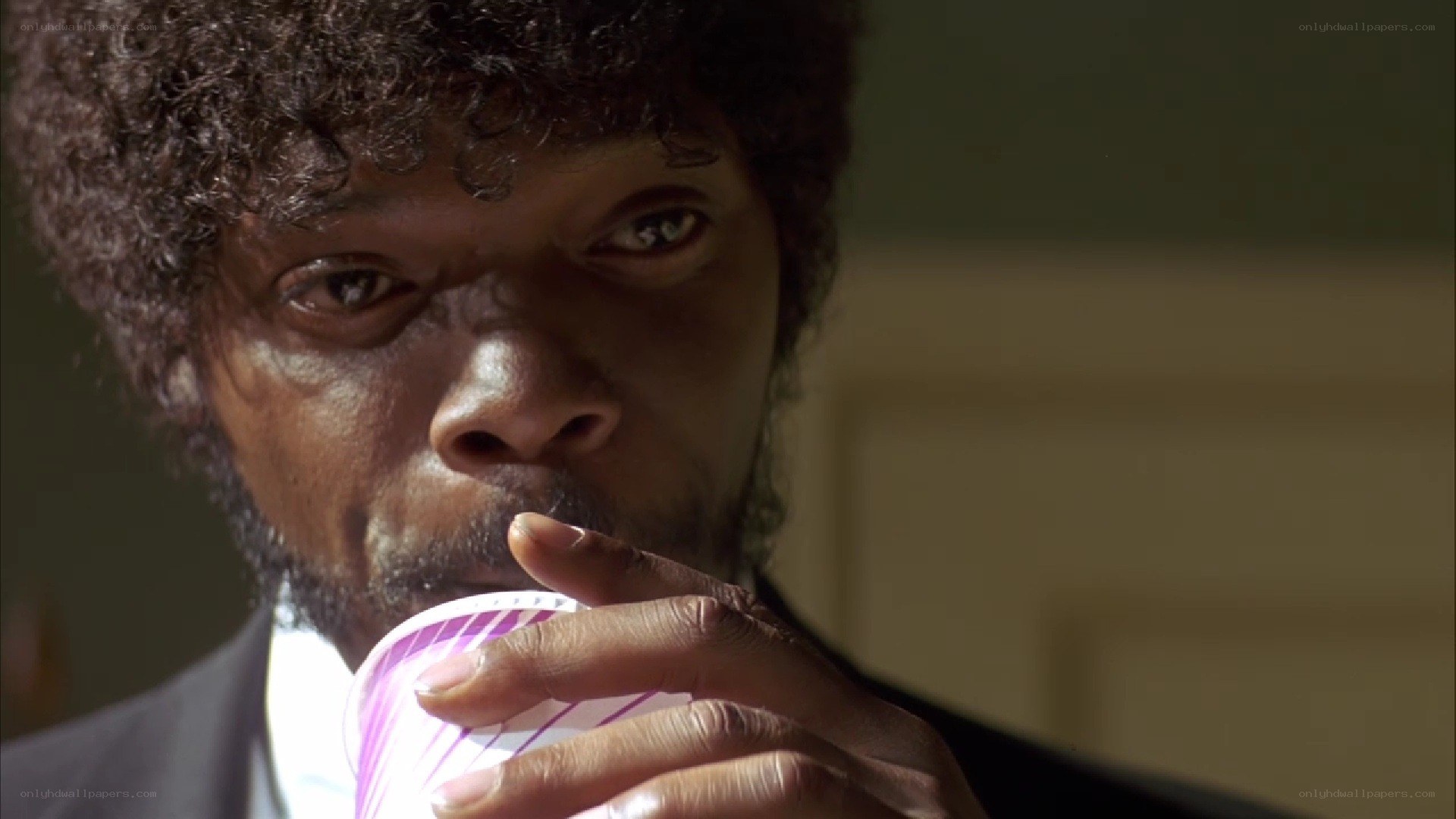 man drinking from cup