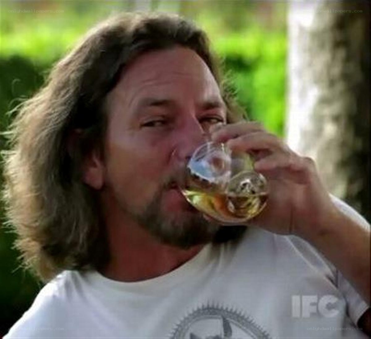 man drinking from glass