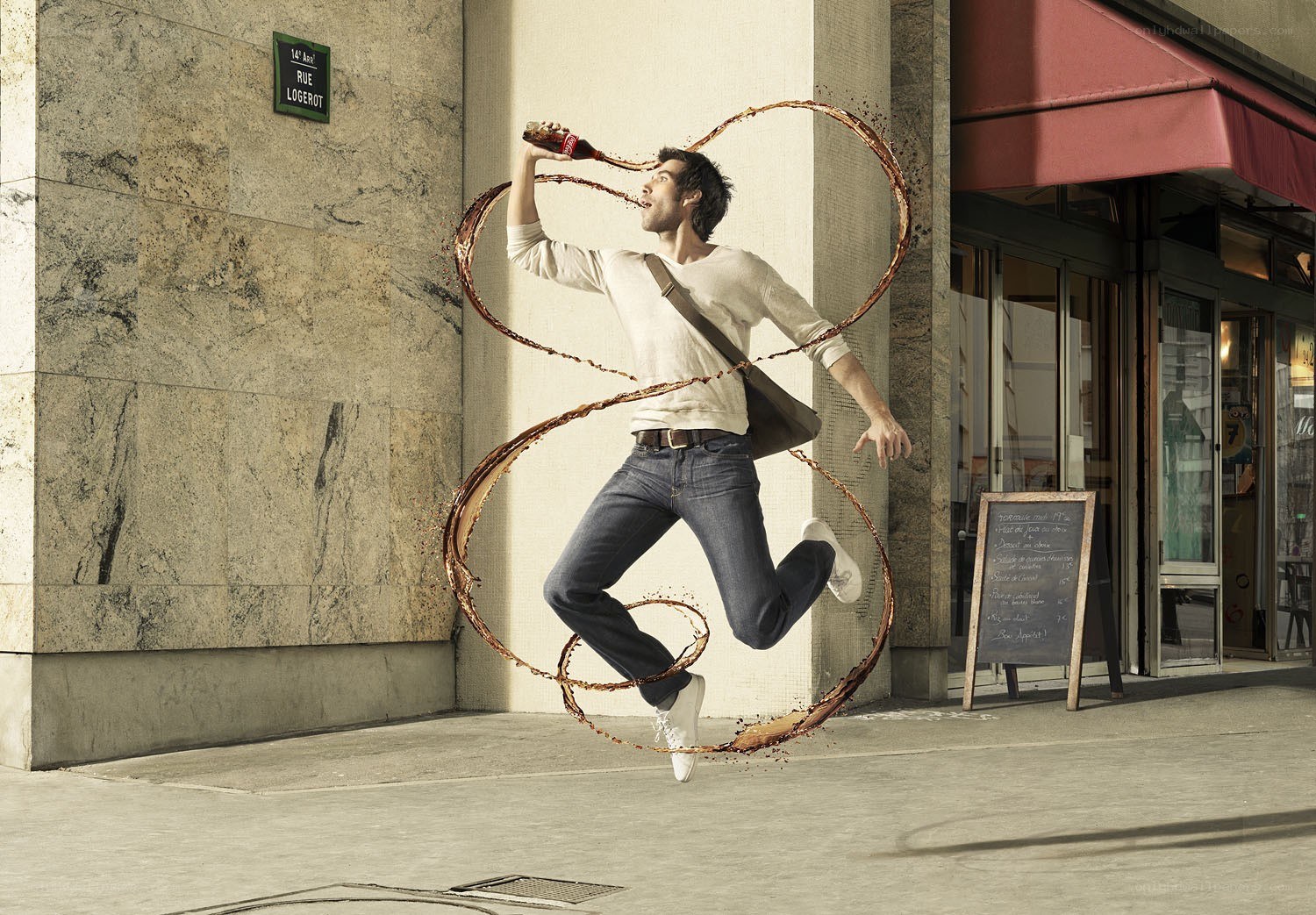 Man drinking soda in mid-air