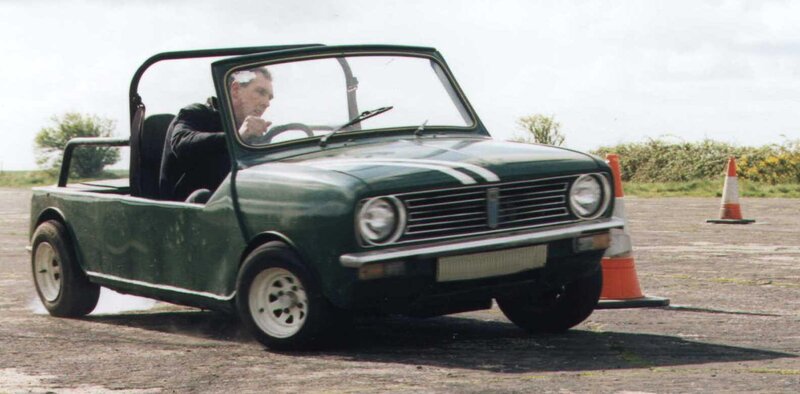 Man driving a green car
