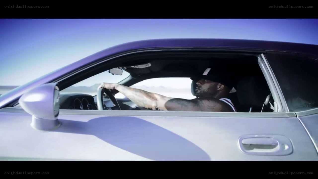 man driving car in desert