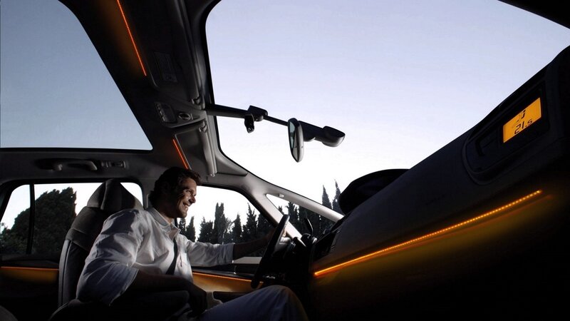 man driving car with ambient lighting