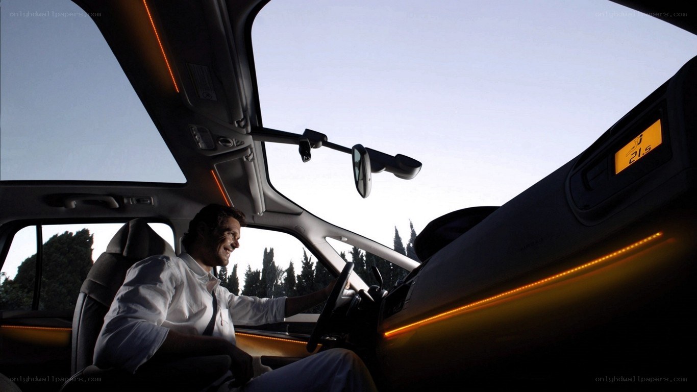 man driving car with ambient lighting
