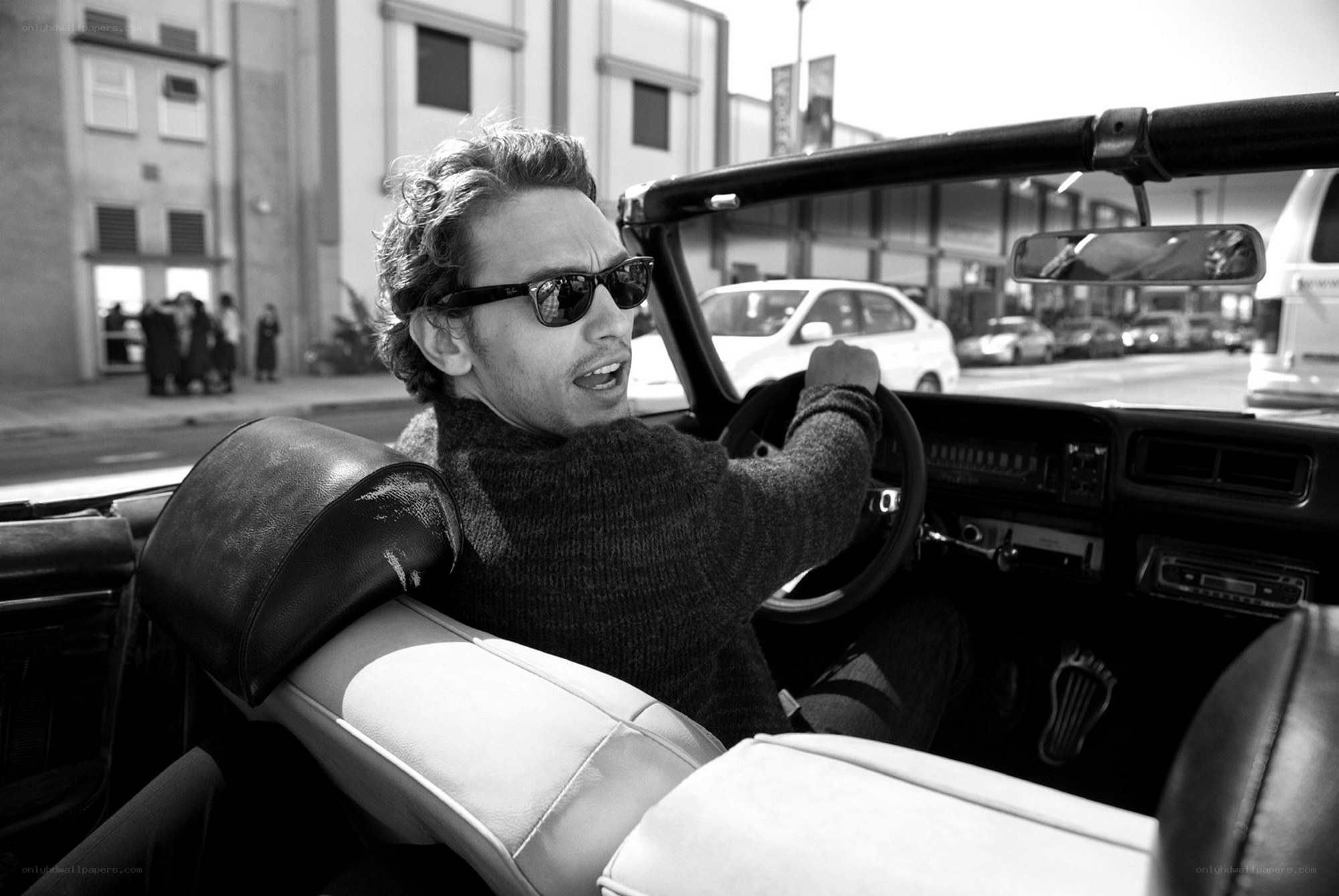 man driving convertible car