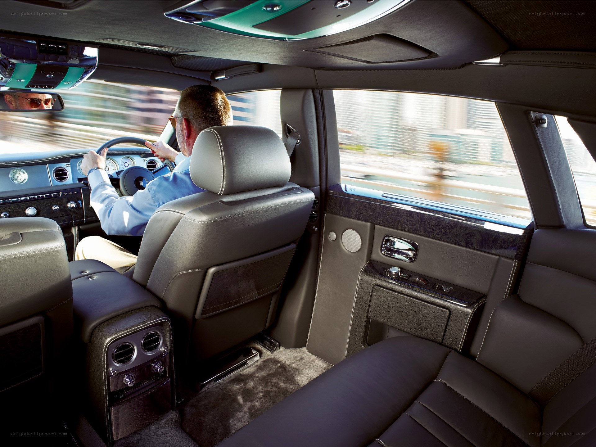Man driving luxury car