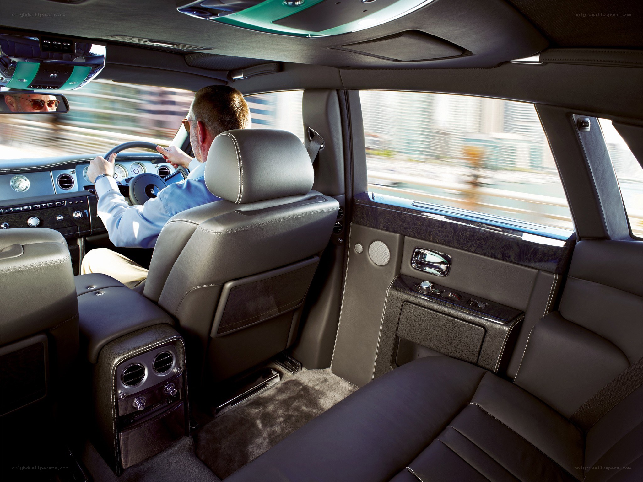 Man driving luxury car