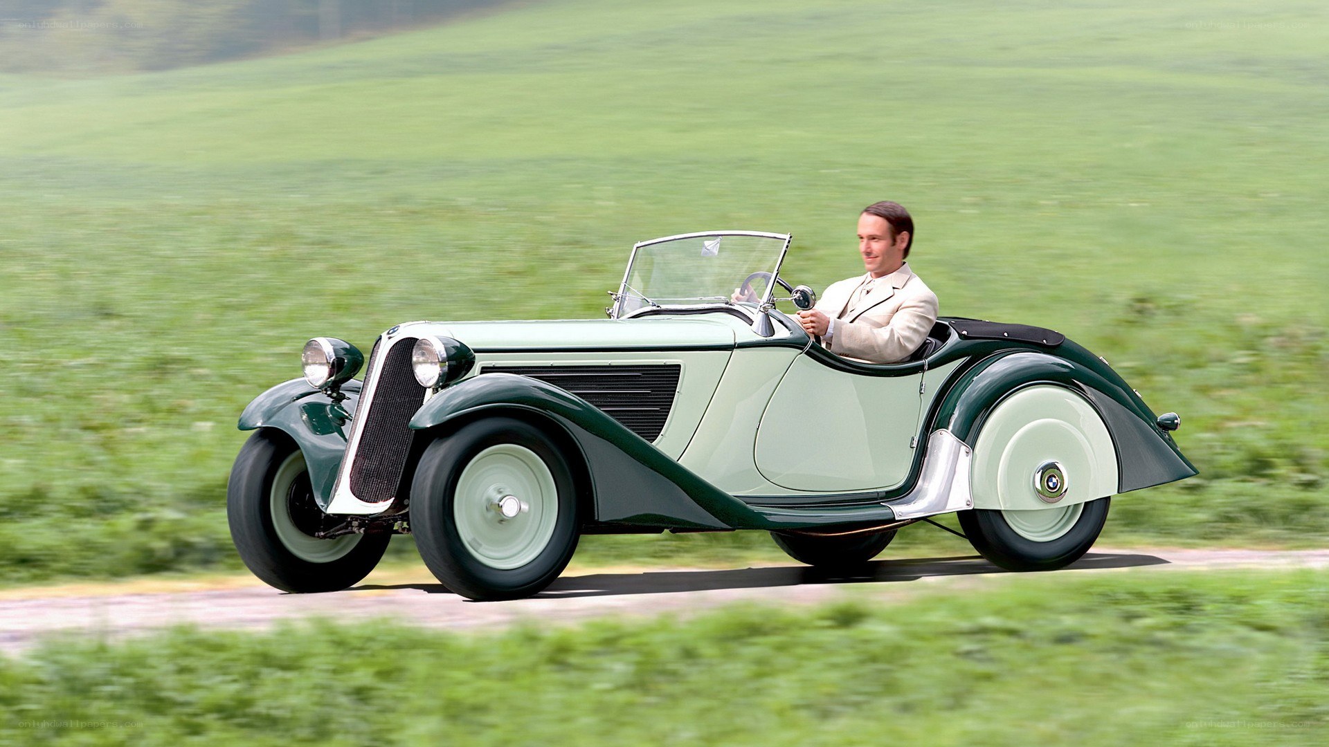 Man driving vintage car