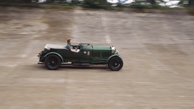 Man driving vintage car
