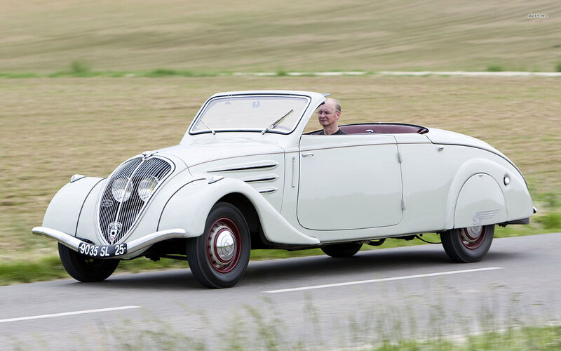 Man Driving Vintage Car — White