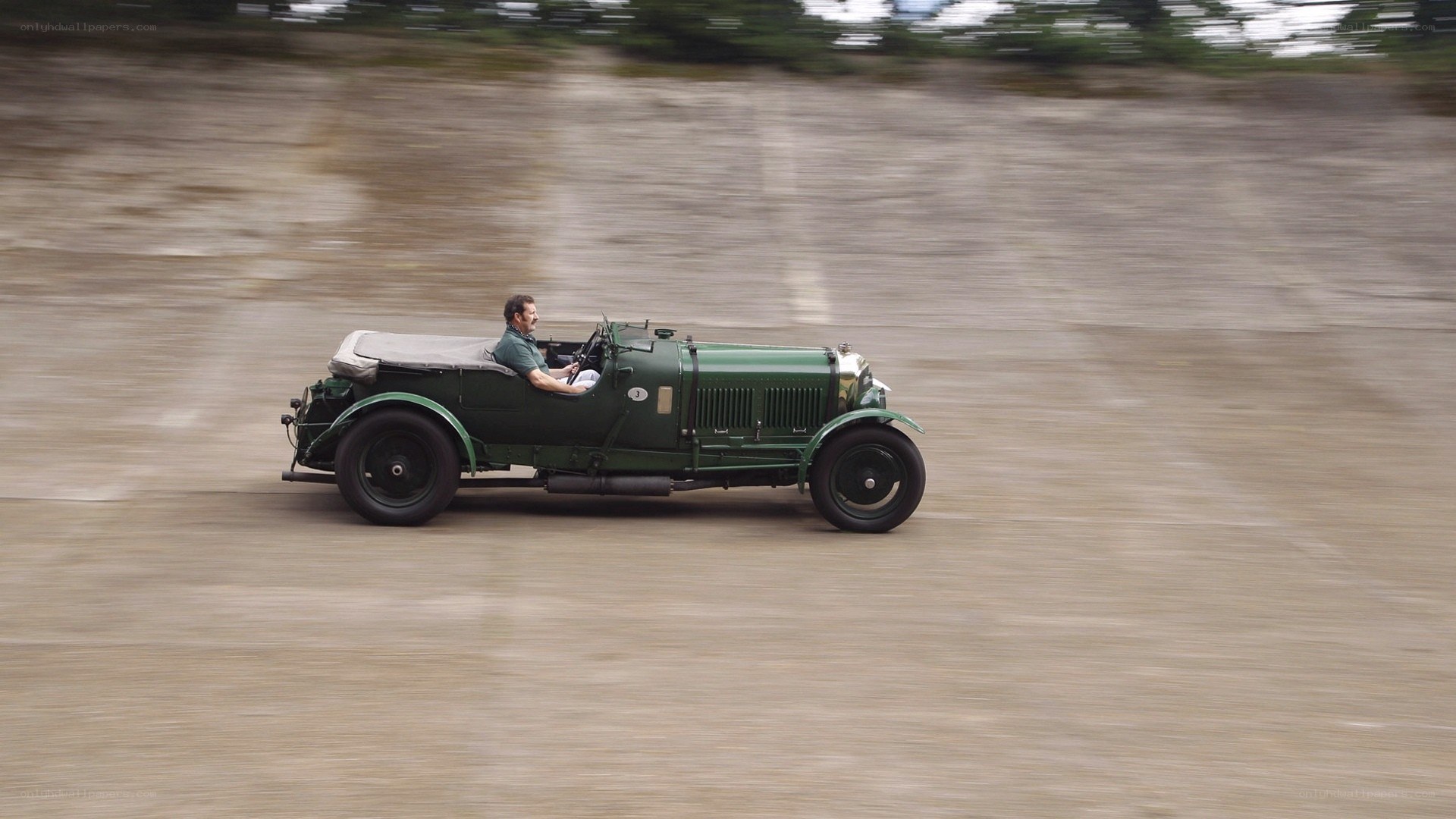 Man driving vintage car