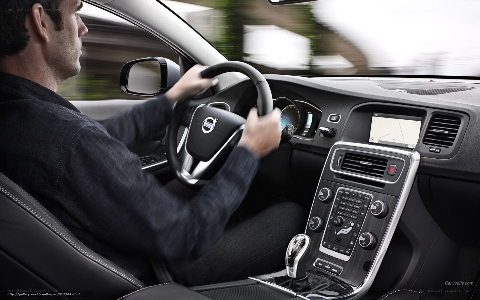 man driving volvo car