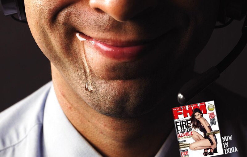 man drooling on magazine