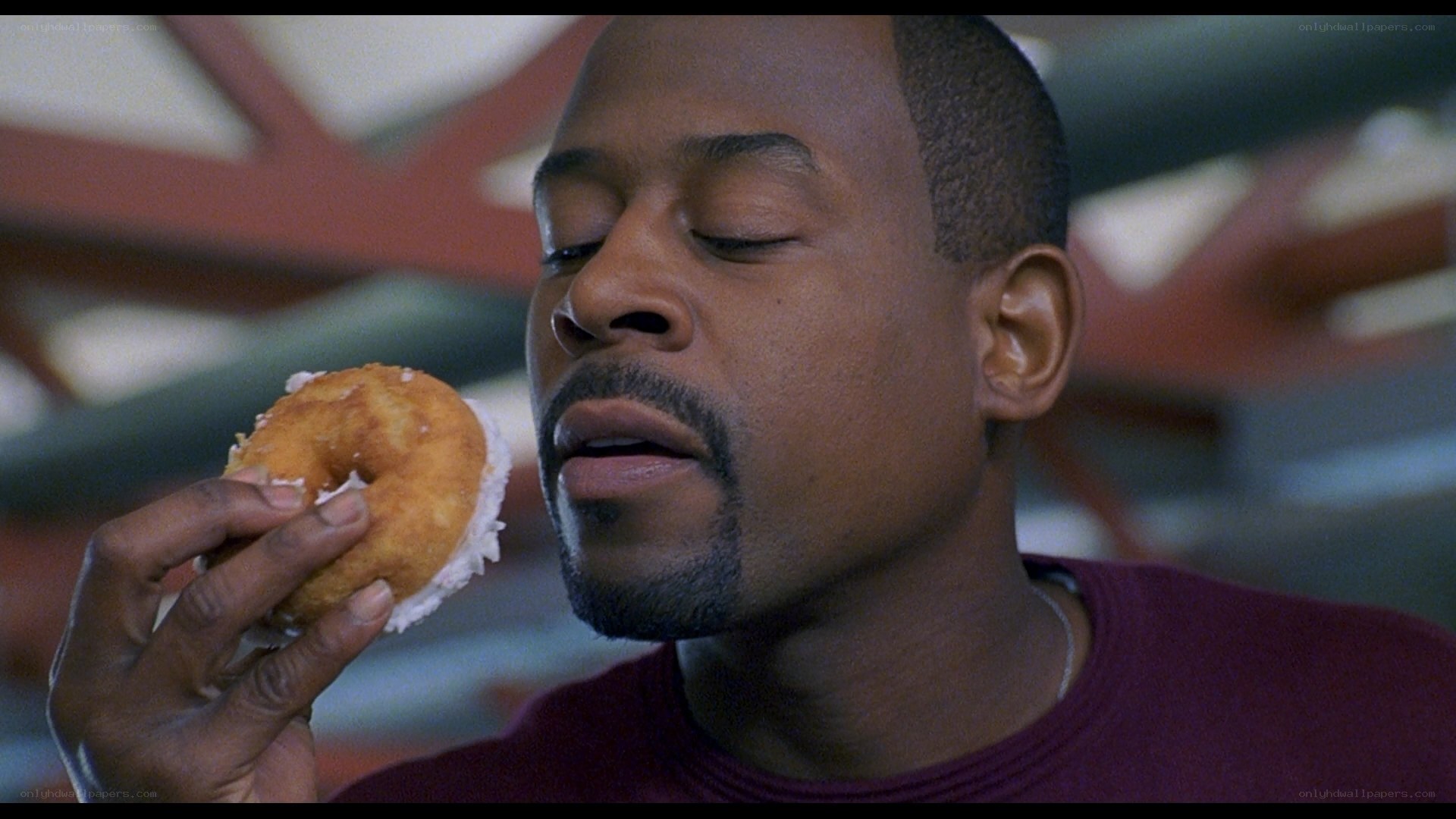 man eating a donut