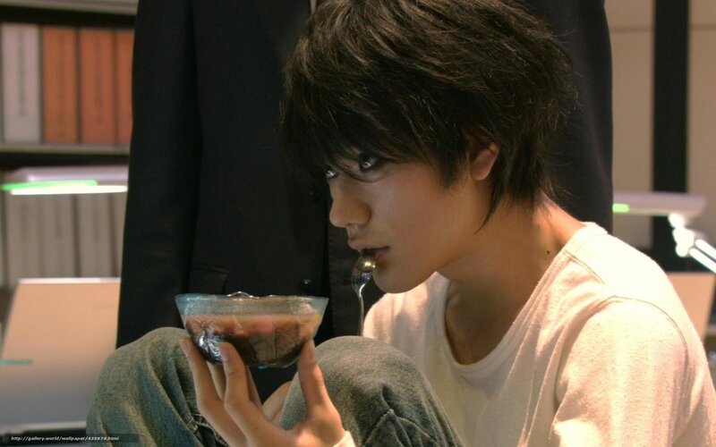 man eating dessert from bowl