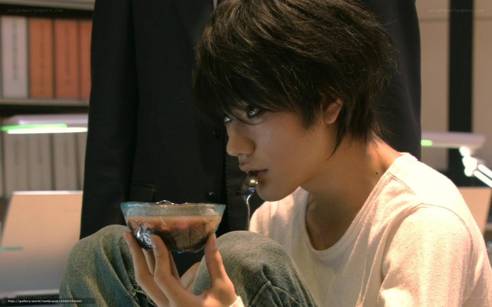 man eating dessert from bowl