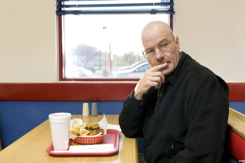 man eating fast food in a diner