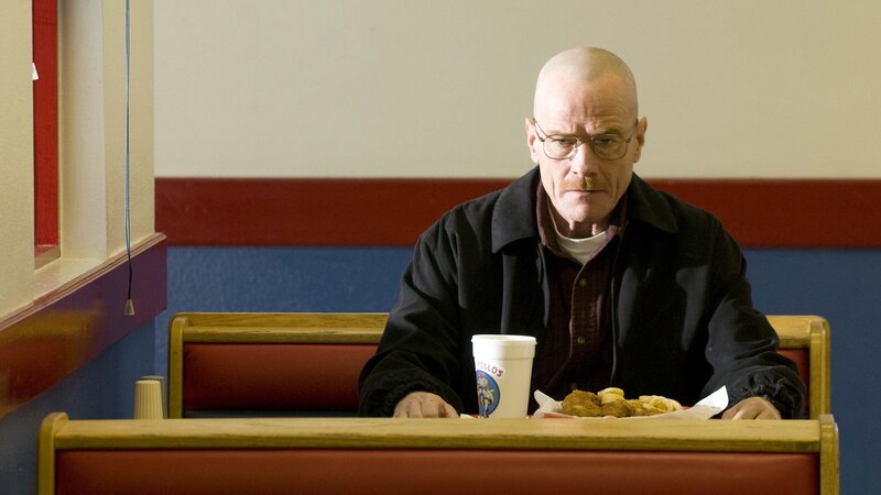 man eating fast food in diner