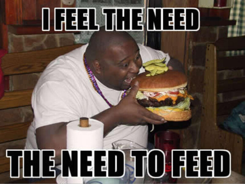 man eating large burger