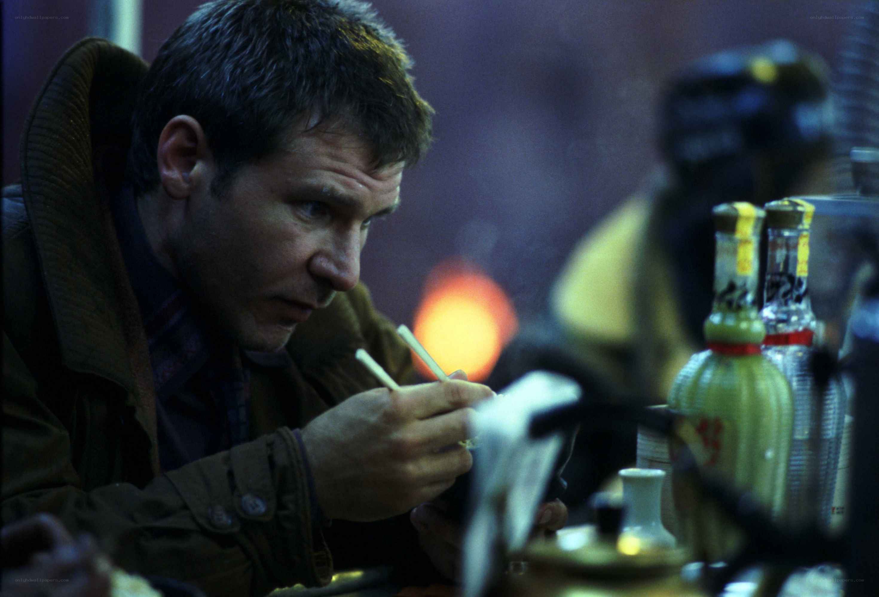 man eating with chopsticks