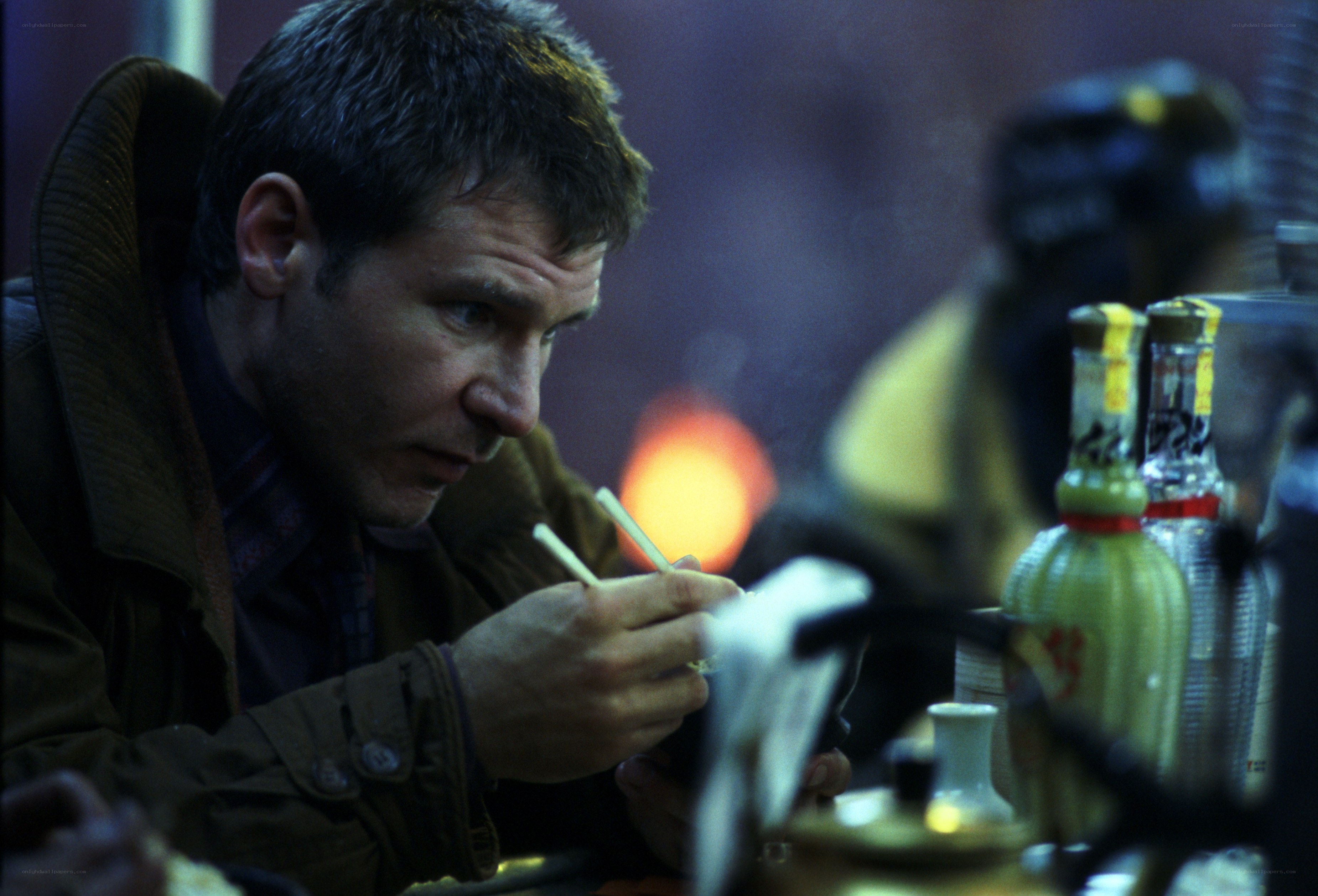 man eating with chopsticks