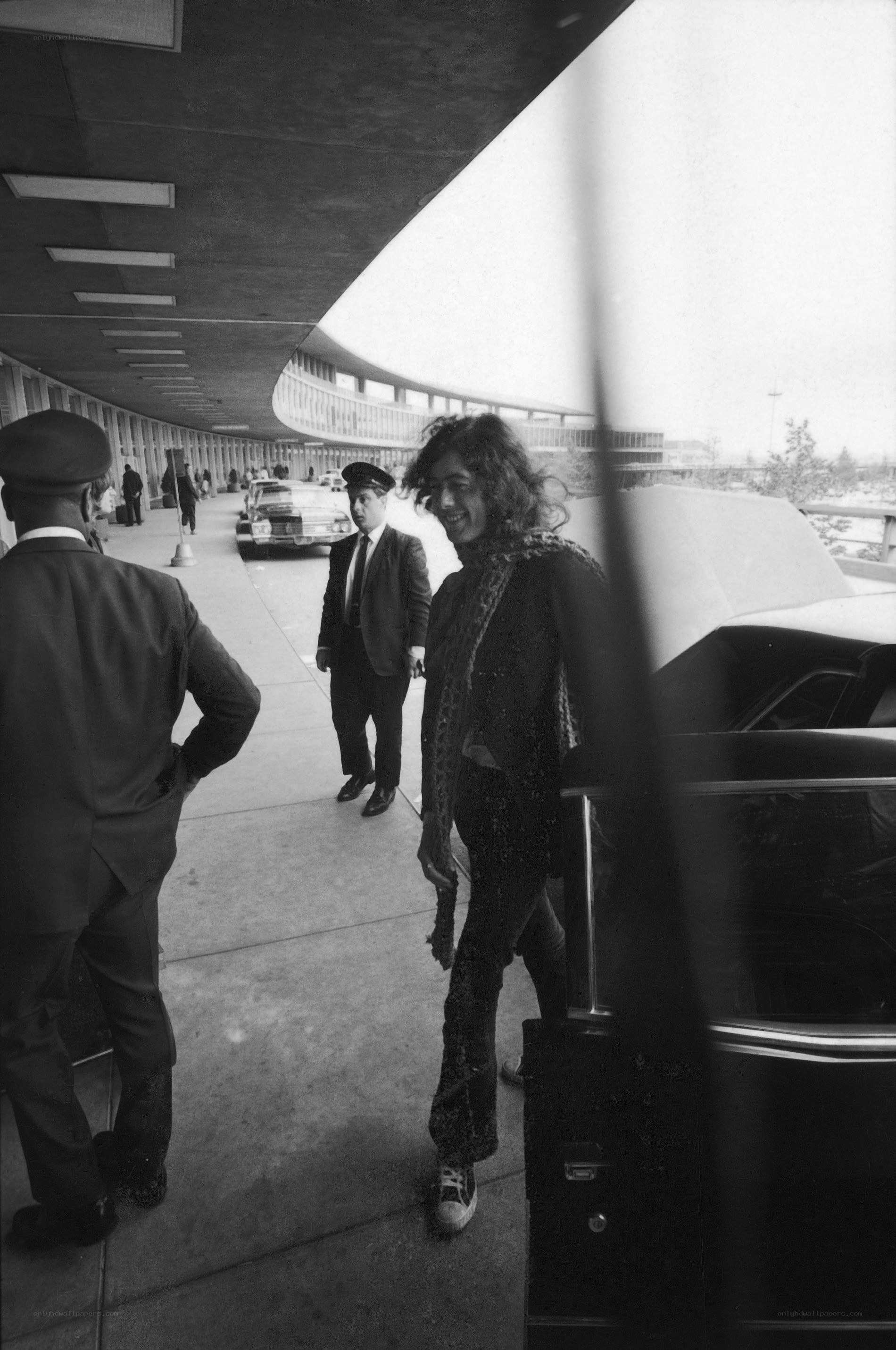 Man exiting car at airport
