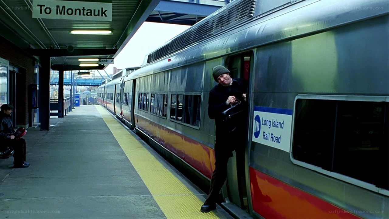 Man exiting train at station