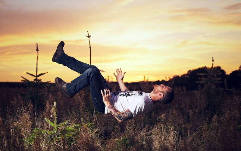Man falling in a field