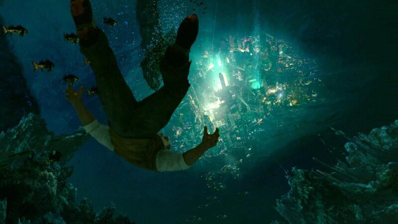 man falling into underwater city