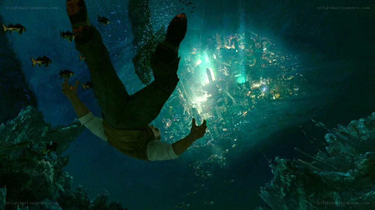 man falling into underwater city