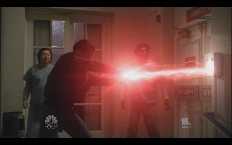 man firing energy beam