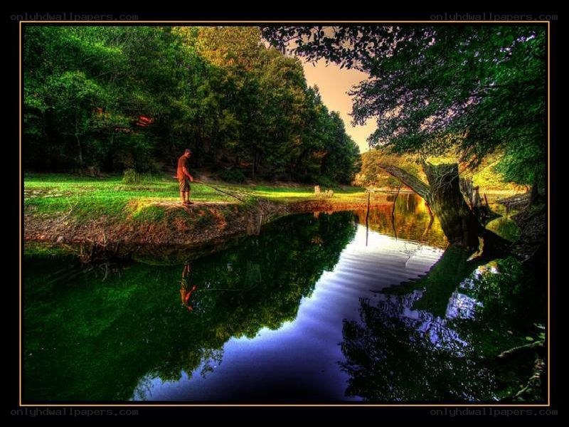 Man fishing by a river