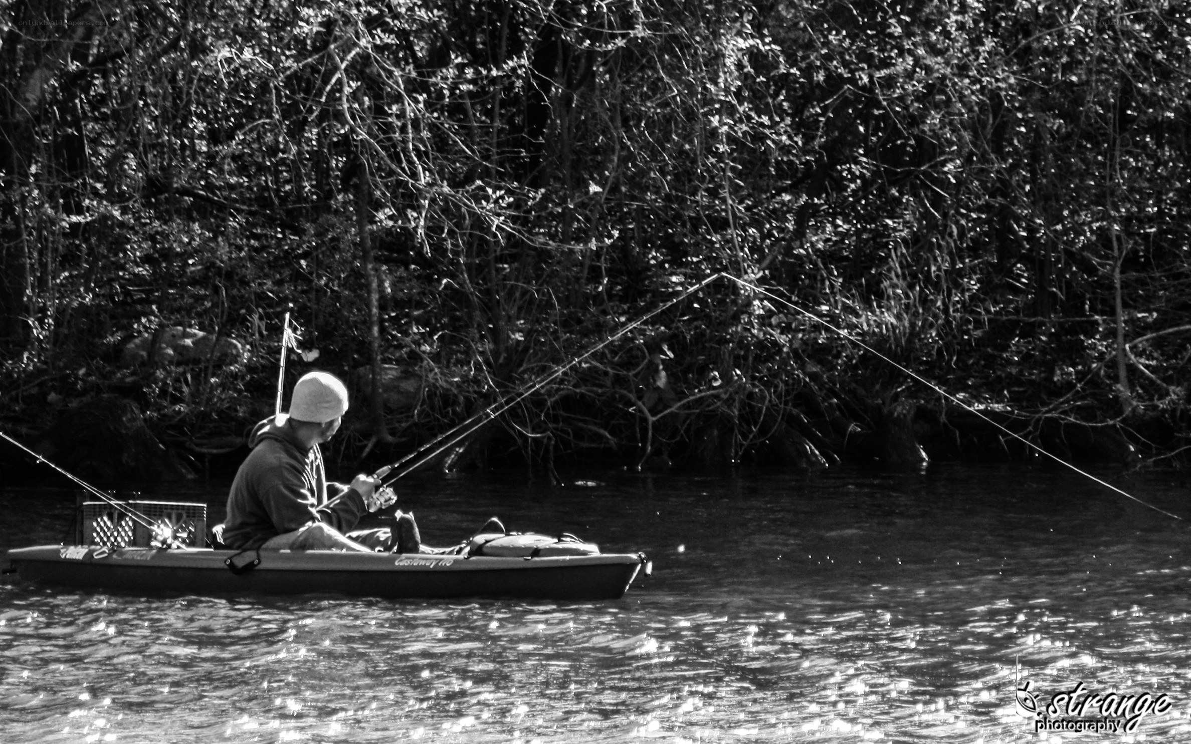 man fishing from a kayak