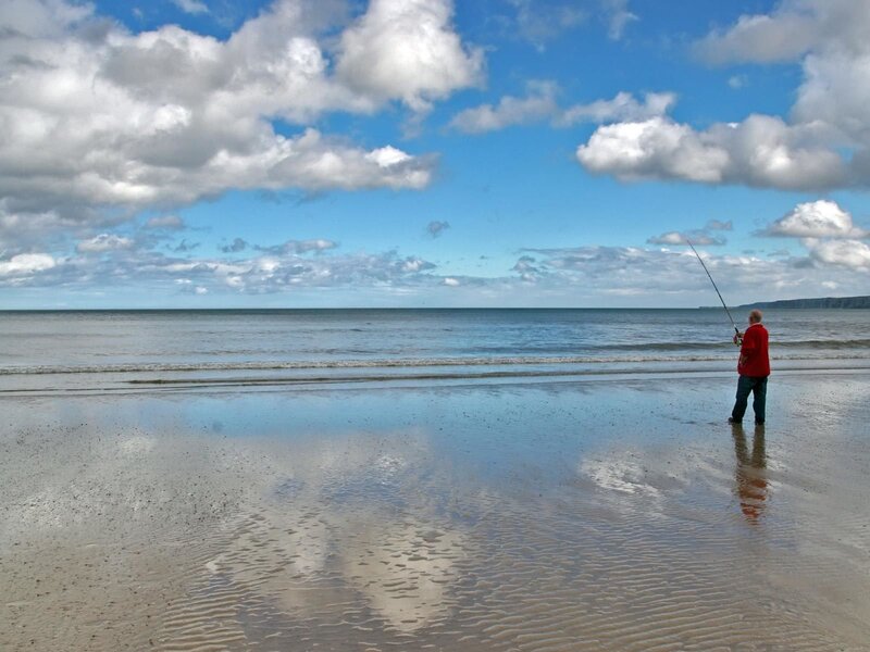 Man fishing on a beach