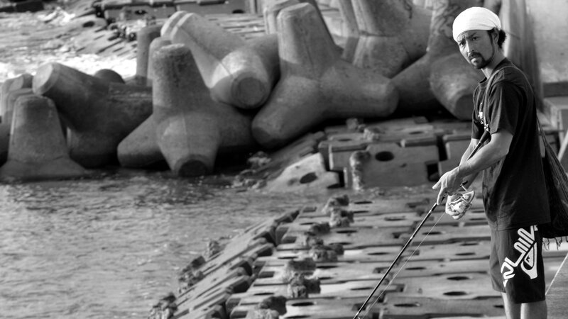 Man fishing on a pier