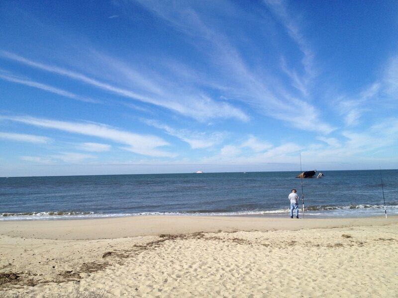 Man Fishing on Beach