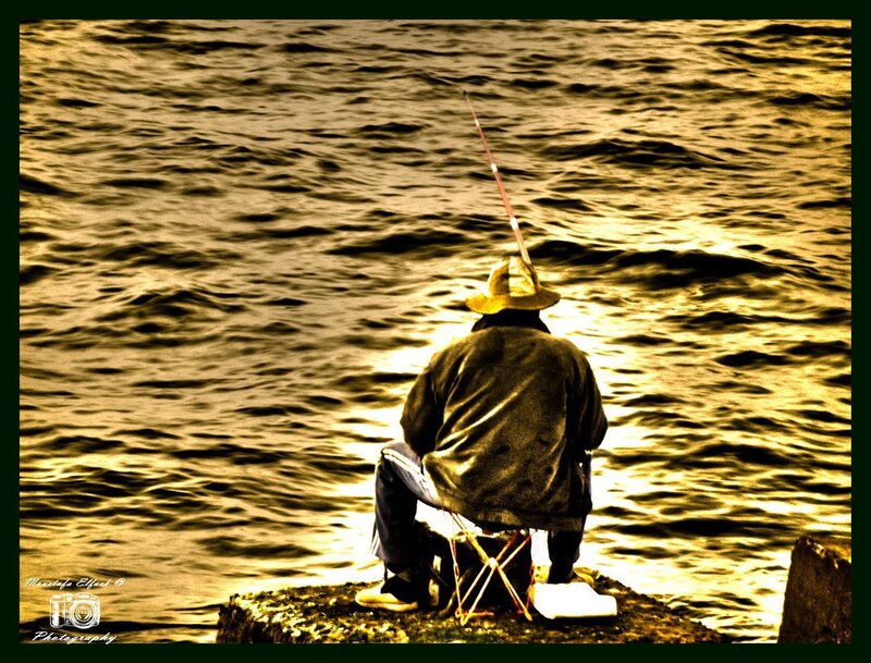 Man Fishing on Pier