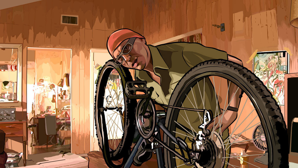 man fixing a bicycle indoors
