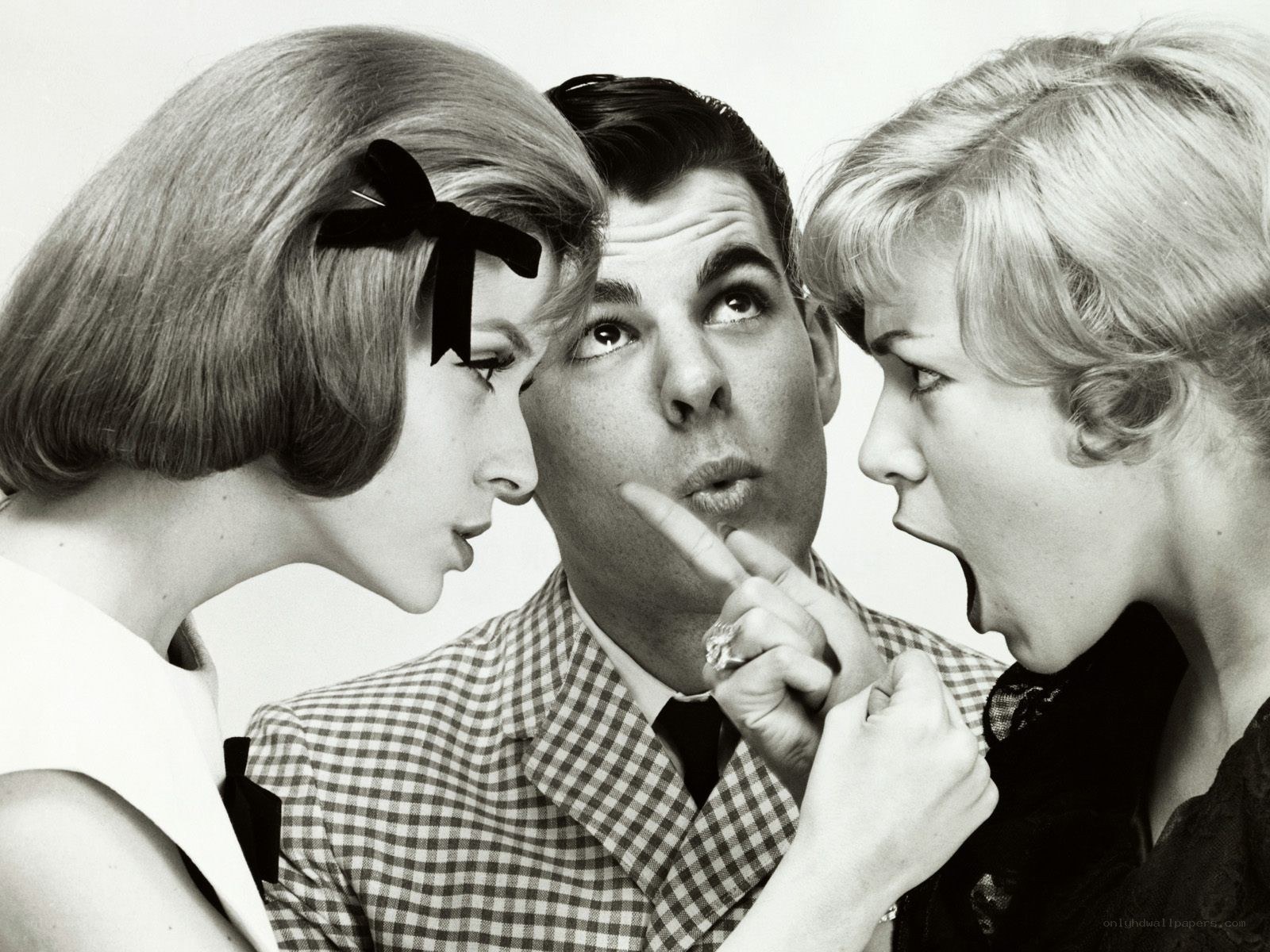 Man flanked by two women