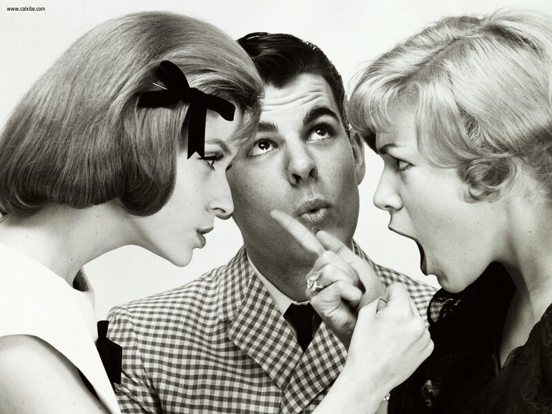 Man flanked by two women
