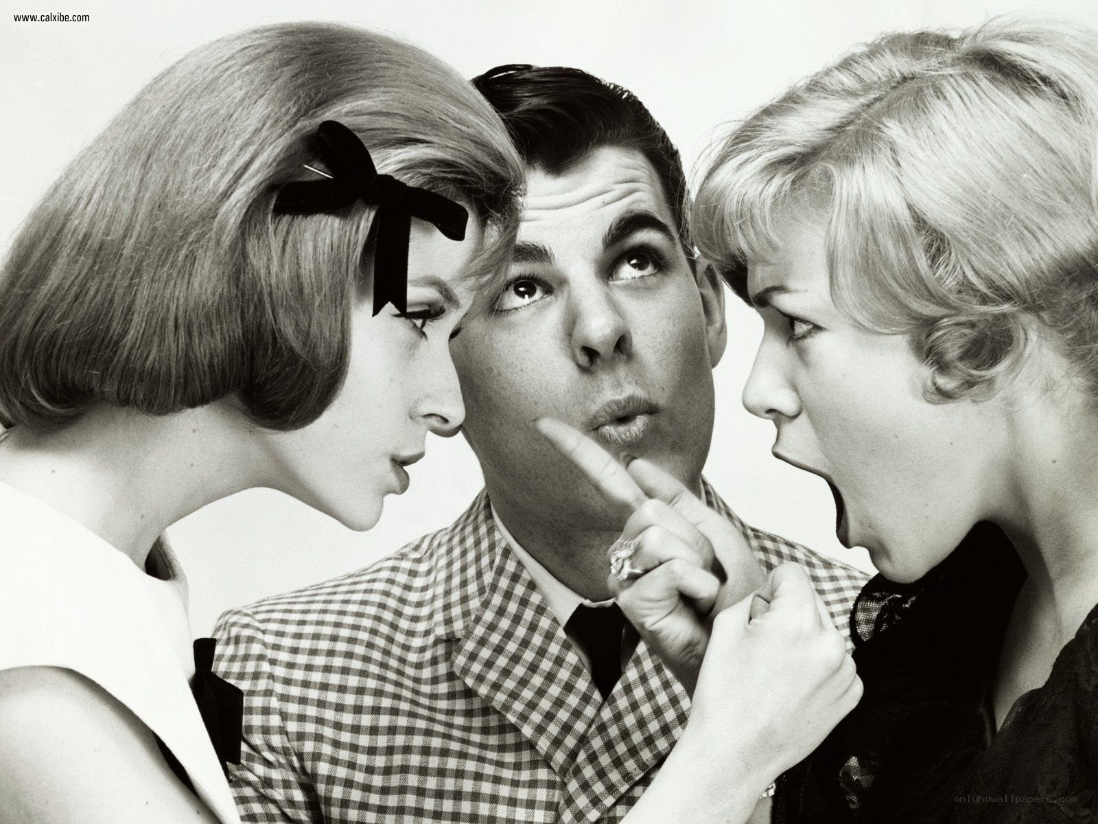 Man flanked by two women