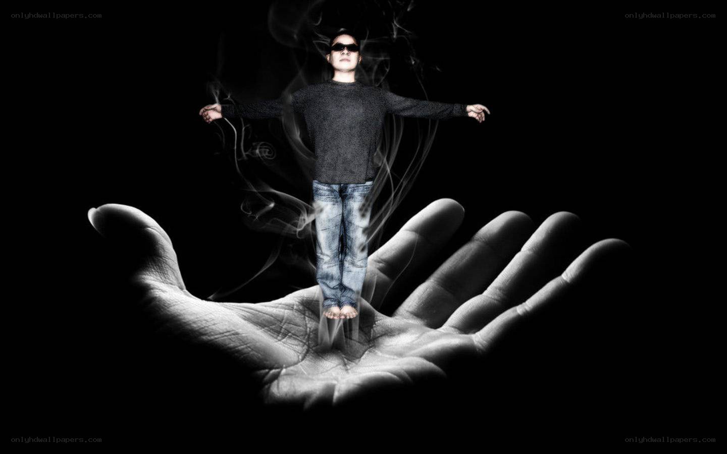 man floating above a hand
